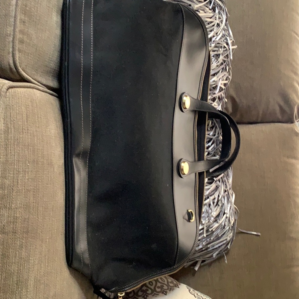 Dooney and bourke black large carry-on. 18 inches wide.